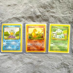 3 starters Pokémon cards charmander, bulbasaur, and squirtle. LP condition.